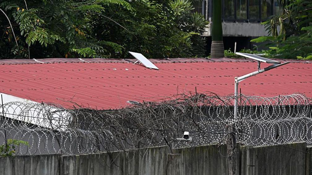 This photo taken on September 17, 2025 shows what appears to be a Starlink satellite dish on the roof of a building at the KK Park complex in Myanmar's eastern Myawaddy township, as pictured from Mae Sot district in Thailand's border province of Tak.