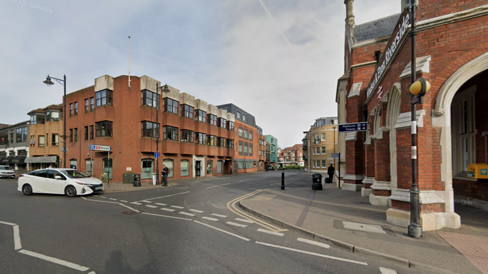A general view picture from Google Maps of the office building on the left - a three-storey building - opposite the brick Windsor and Eton Riverside train station.