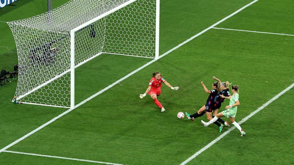 Chloe Kelly scores for England against Italy in the semifinal of Euro 2025 after here penalty was saved.