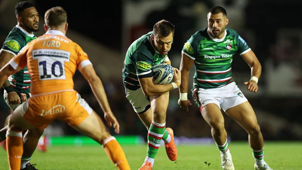 Handre Pollard runs at George Ford