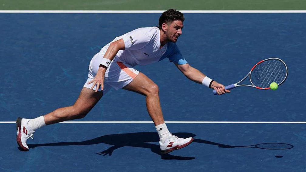 Cameron Norrie reaches to play a forehand at the US Open