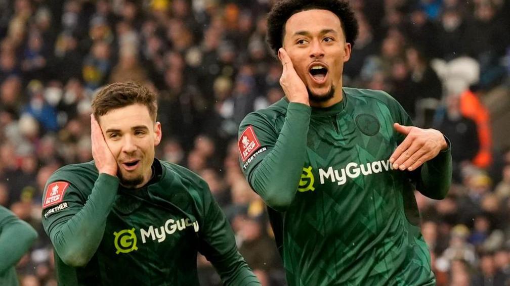 Millwall's Femi Azeez (right) celebrates scoring against Leeds United at Elland Road