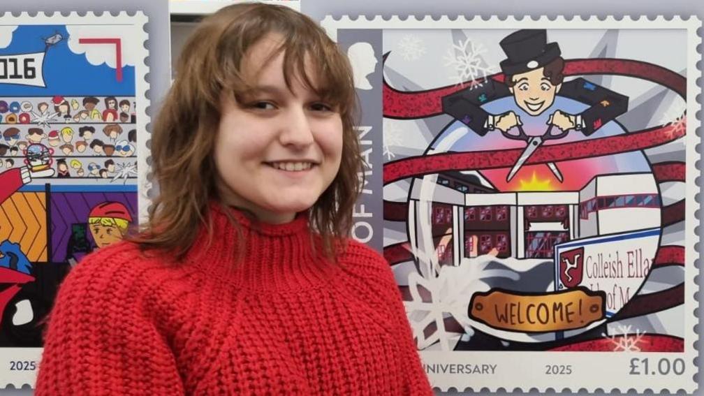 Izabela, an 18-year-old girl with a red jumper, she has brown hair and a fringe and smiles. She stands next to a stamp with a snow globe with the Homefield campus pictured inside, a man with a black top hat and suit cuts open a ribbon.