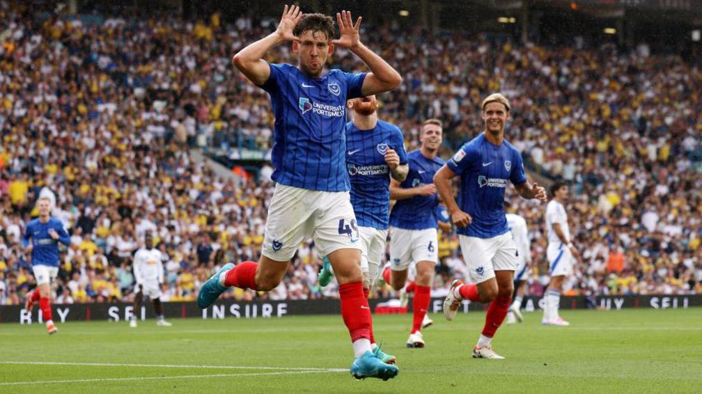 Callum Lang of Portsmouth celebrates scoring during the Championship match between Leeds United and Portsmouth.