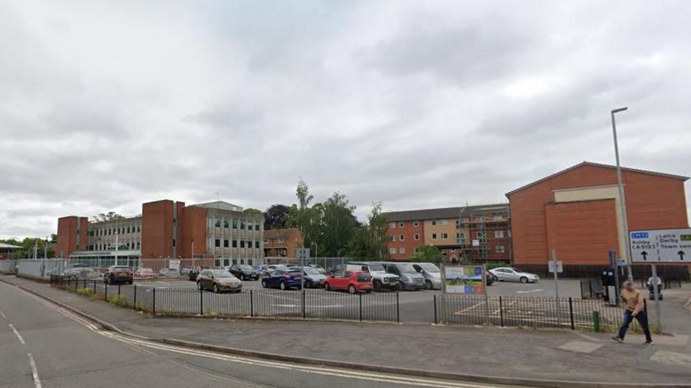 Southfields Extension car park with a number of red brick buildings in the background