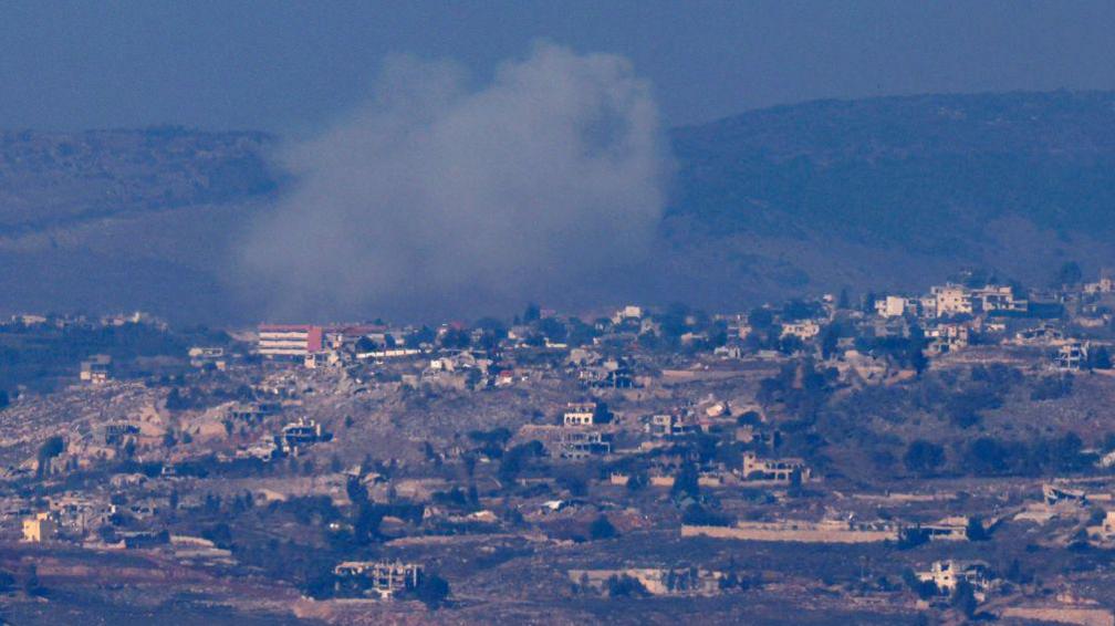 Smoke billows from the southern Lebanese town of Khiam during Israeli bombardment on 2 December 2024, as seen from northern Israel (AFP)