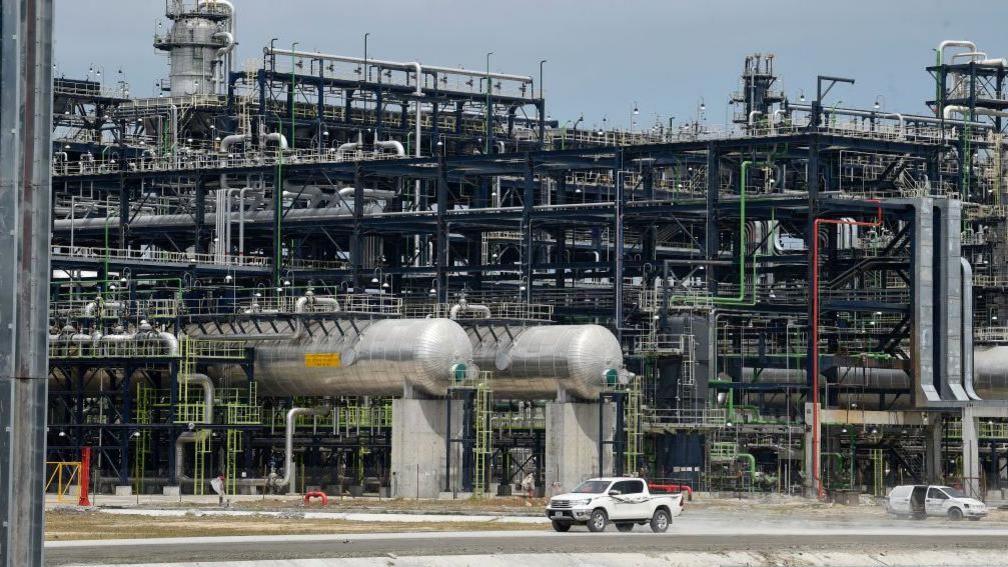 Dangote Petroleum Refinery, with a vehicle on the road