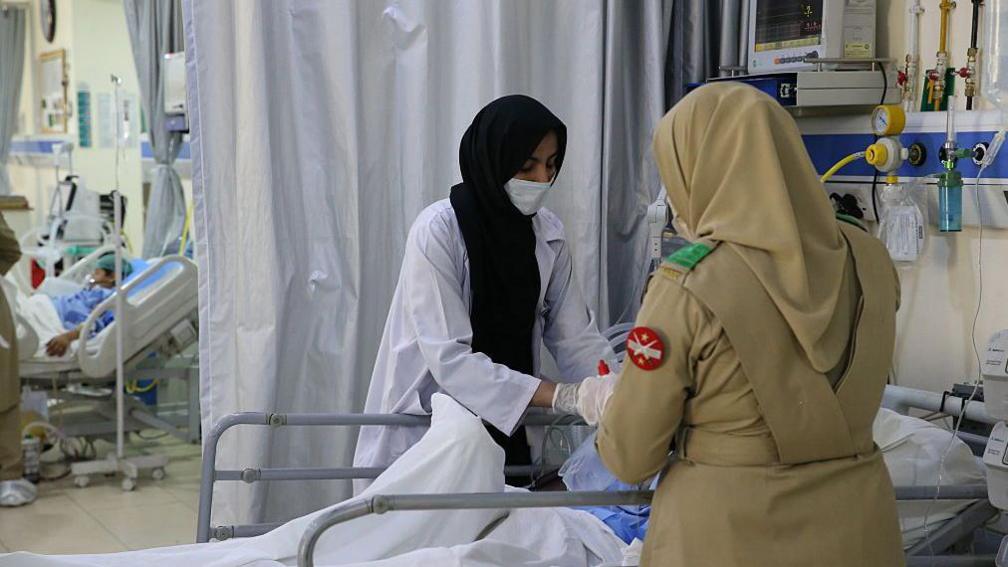 Students injured in a bomb attack on a school bus receive medical treatment in a hospital on May 23, 2025 in Balochistan province, Pakistan.