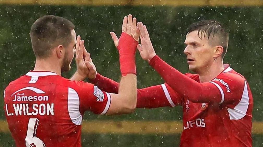 Portadown defender Steven McCullough clears the ball against Larne