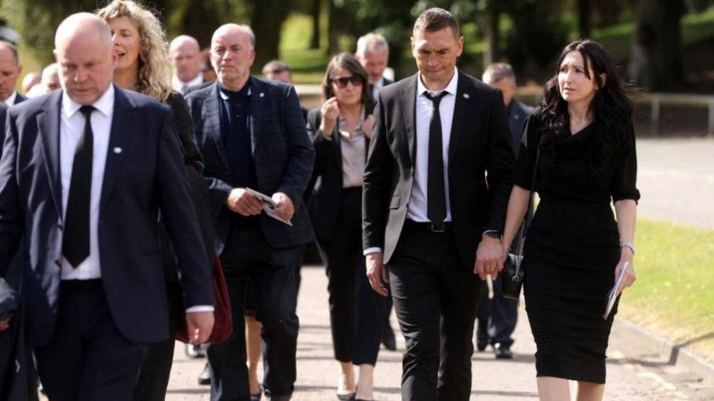 Kevin Sinfield and other guests leaving the service