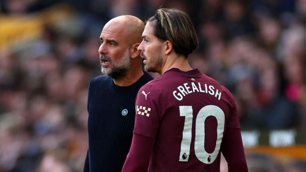 Pep Guardiola and Jack Grealish