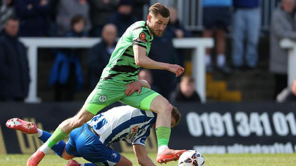 Harvey Bunker beats a Hartlepool defender for Forest Green with the ball at his feet