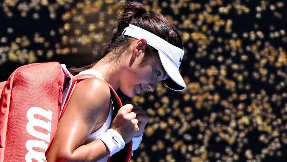 Emma Raducanu trudges off court after losing to Iga Swiatek at the Australian Open