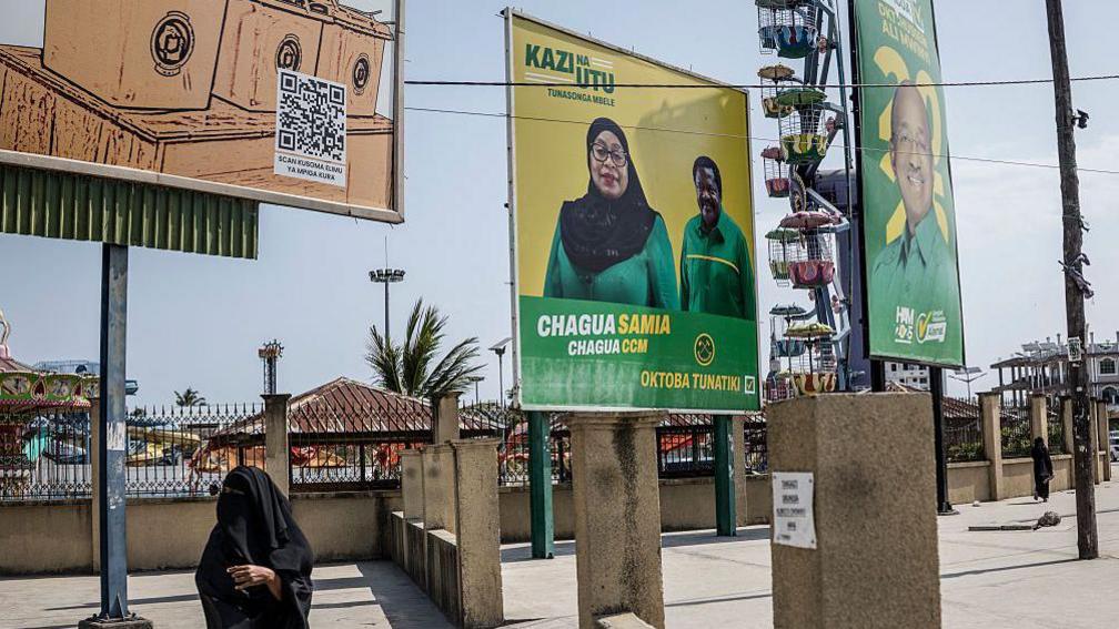 Electoral posters of the ruling Tanzanian Chama Cha Mapinduzi can be seen on a street.