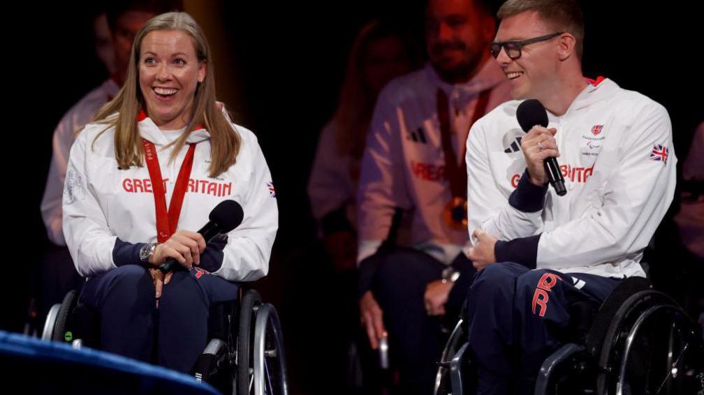 Hannah Cockroft (left) and Nathan Maguire smiling at the event