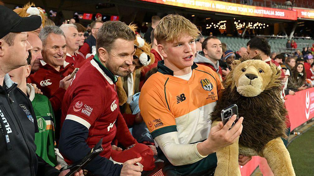Henry Pollock takes a selfie with Lions fans