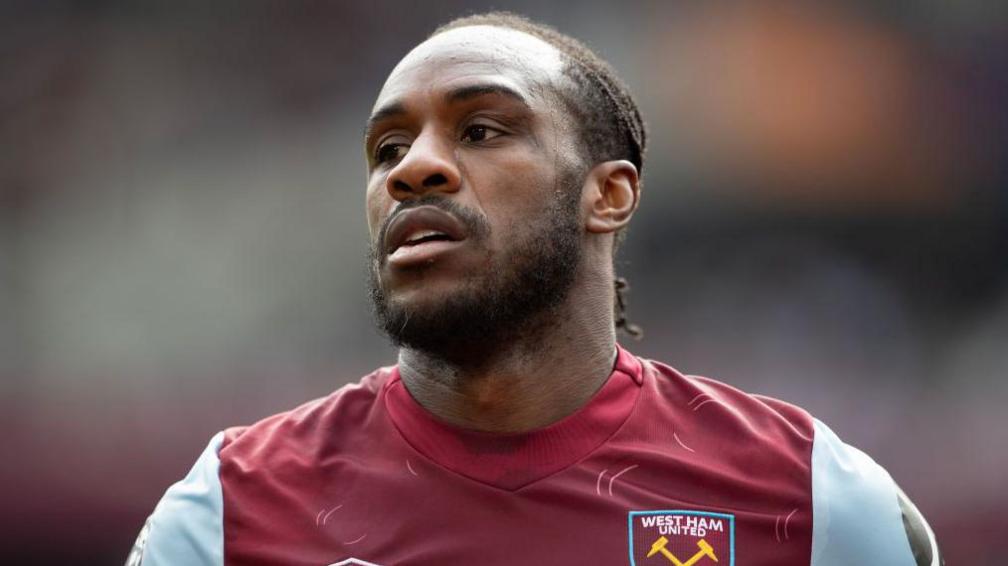 Michail Antonio wearing a West Ham shirt