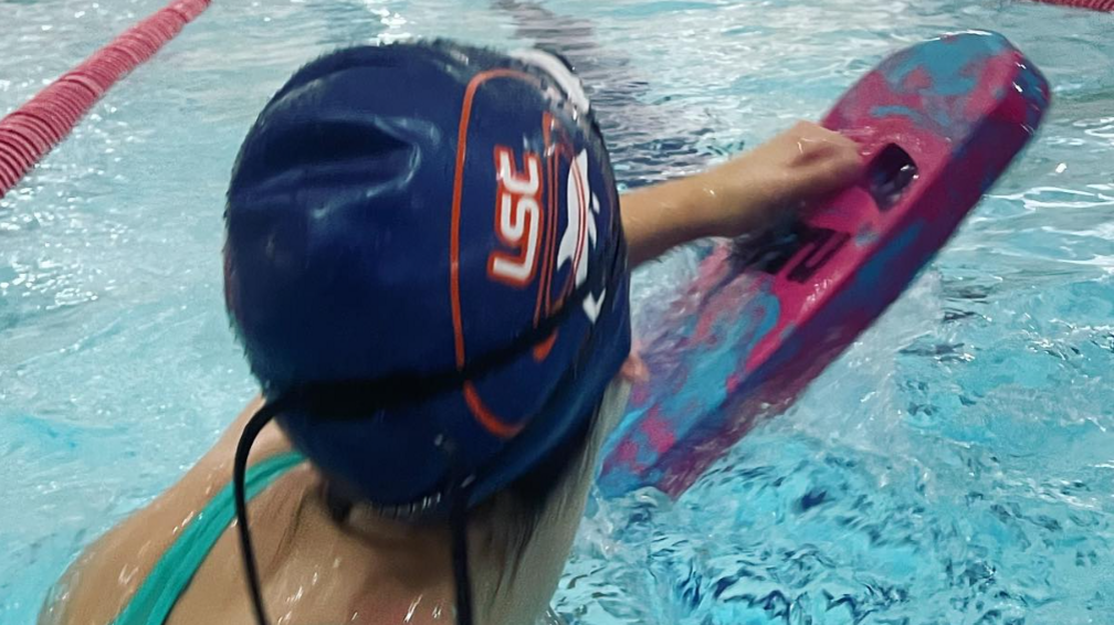 Woman with a Ludlow Swimming Club cap on