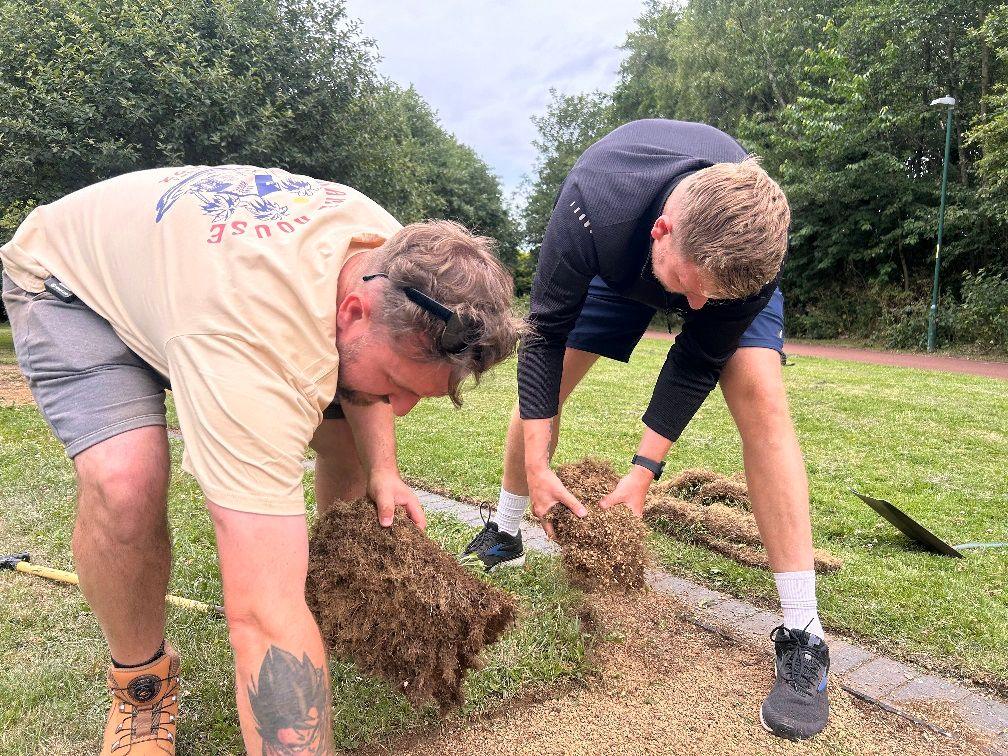 Iain and Craig pulling up turf.