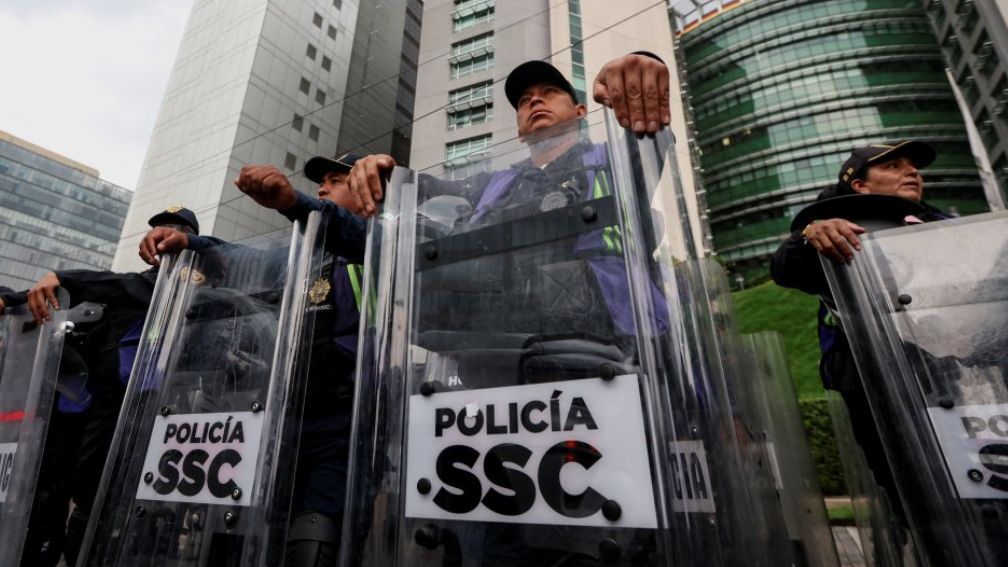 Police near the England team's hotel before their arrival for their World Cup last-16 game with Mexico in Mexico City