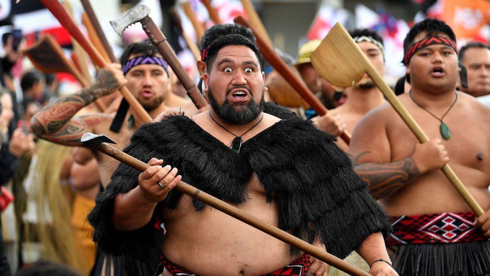 Members of the Māori community march in a protest rally to criticise the government for its policies affecting the Indigenous Mori population in Wellington.