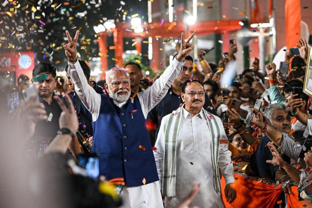 Narendra Modi, India's prime minister, greets supporters at the Bhartiya Janata Party (BJP) headquarters during election results night in New Delhi, India, on Tuesday, June 4, 2024