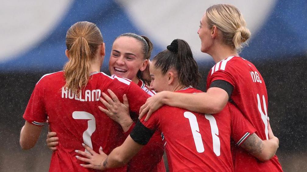 Wales players celebrate Lily Woodham's goal 