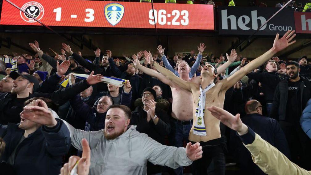 Leeds United fans celebrate their second successive comeback win - beating rivals Sheffield United 3-1 at Bramall Lane on Monday