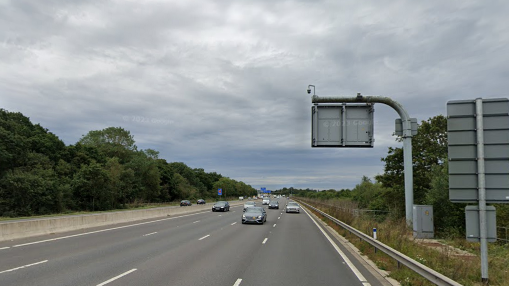 A Google street view screenshot of a motorway with trees on either side.