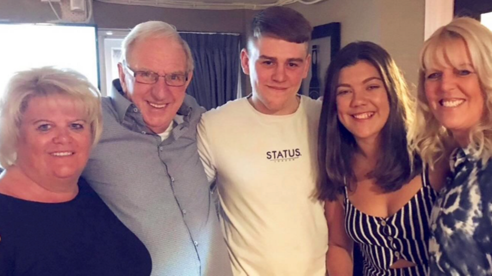 Connor Walker (centre) photographed with his family.