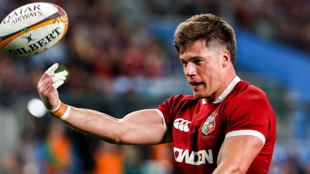 Huw Jones celebrates scoring his first try