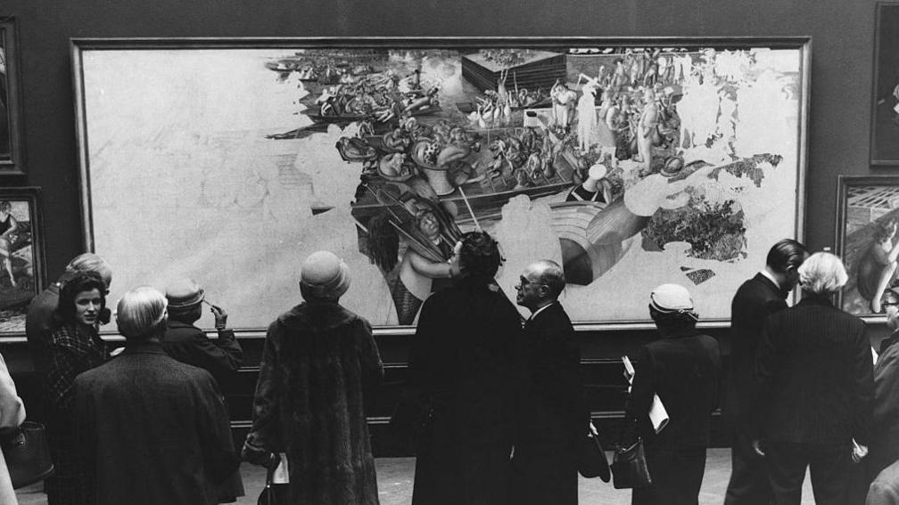 The late Sir Stanley Spencer's unfinished painting Christ Preaching At Cookham Regatta shown at a private viewing of the Royal Academy's summer exhibition.