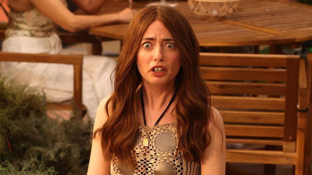 Sarah Sherman, dressed to resemble Aimee Lou Wood's The White Lotus character and with large prosthetic teeth, in a SNL sketch