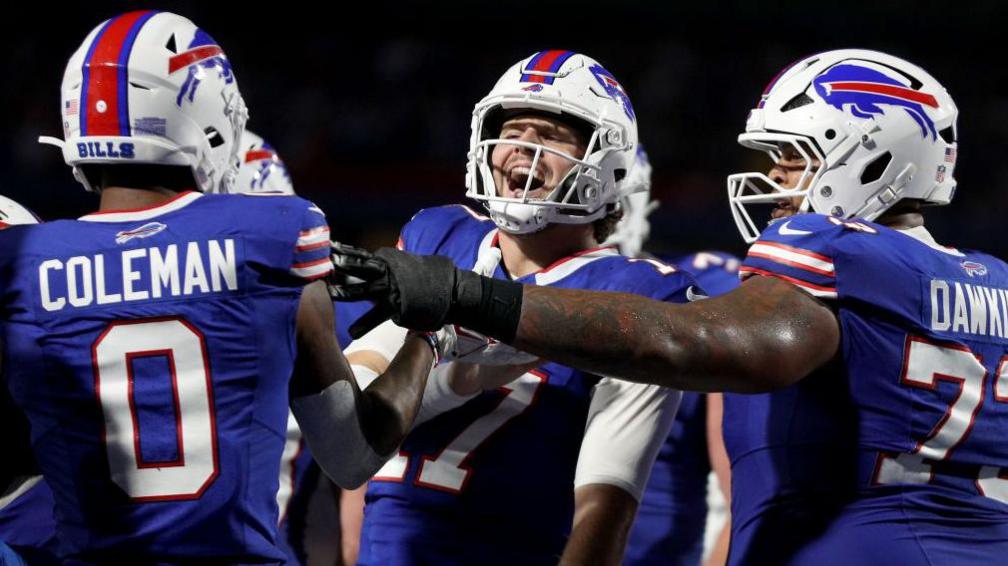 Josh Allen celebrating a touchdown with his team-mates