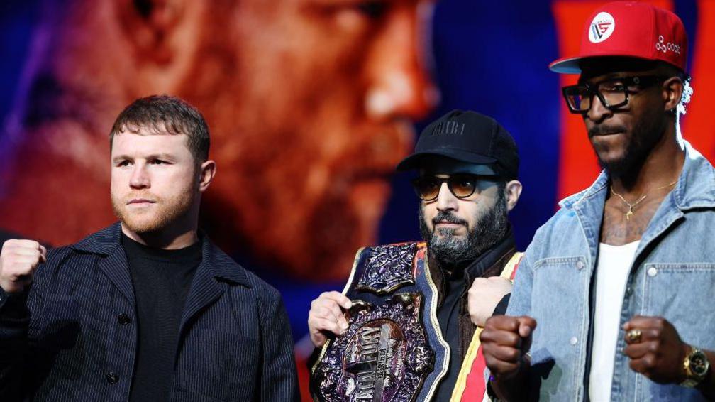 Saul 'Canelo' Alvarez and William Scull pose with their firsts up at a news conference