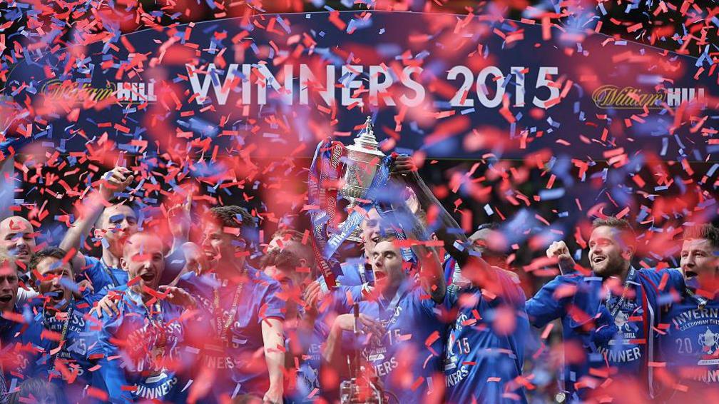 Red and blue confetti drops down on Inverness players as they celebrate their Scottish Cup win over Falkirk in 2015