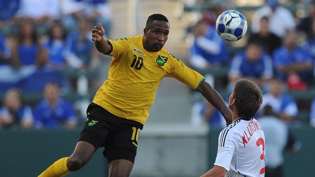 Jamaica's Ricardo Fuller leaps above Canada's Michael Klukowski during their Concacaf Gold Cup game in 2009