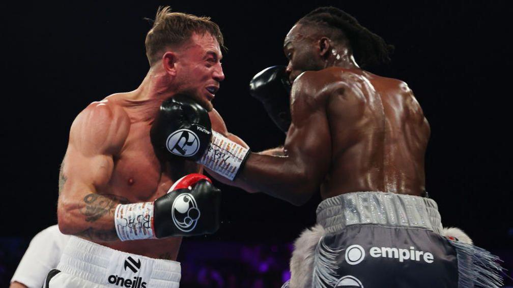 Denzel Bentley and Brad Pauls exchange punches during their middleweight contest