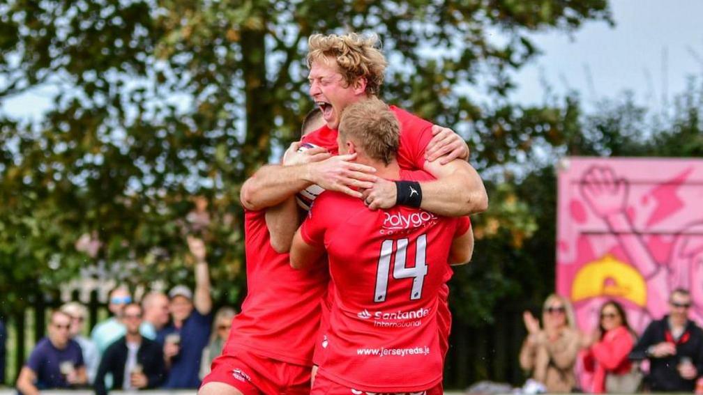 Scott van Breda celebrates scoring a try