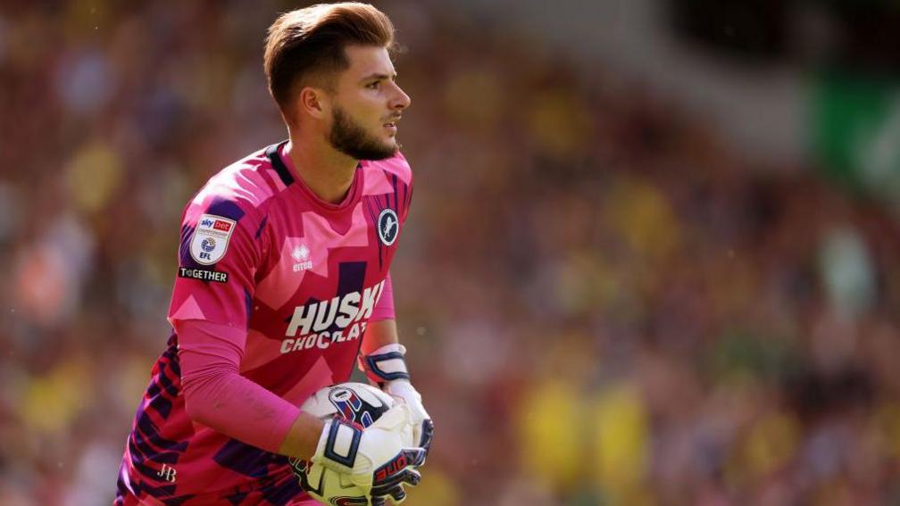 Matija Sarkic holds the football while keeping goal for Millwall