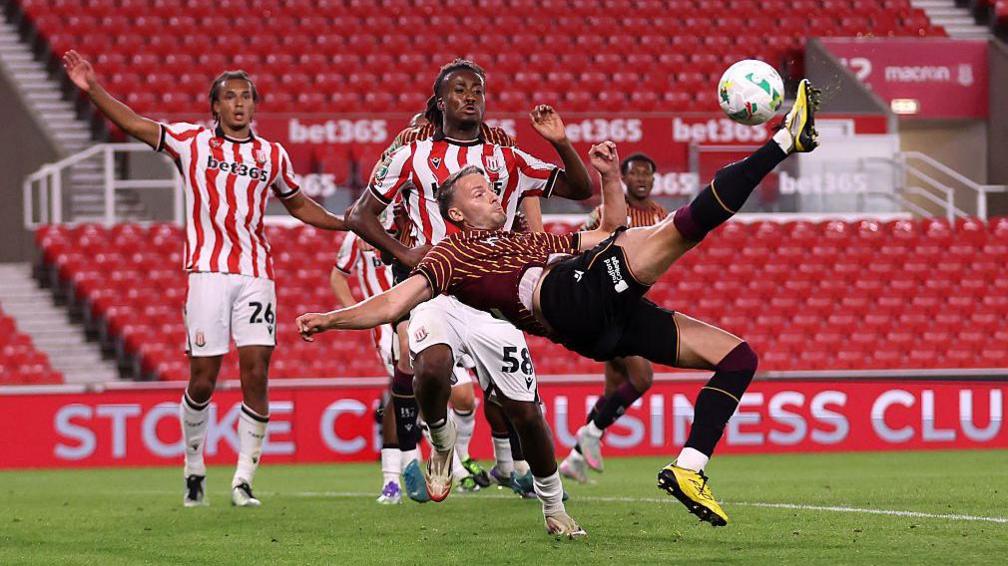 Bradford's Nick Powell attempts a bicycle kick against Stoke