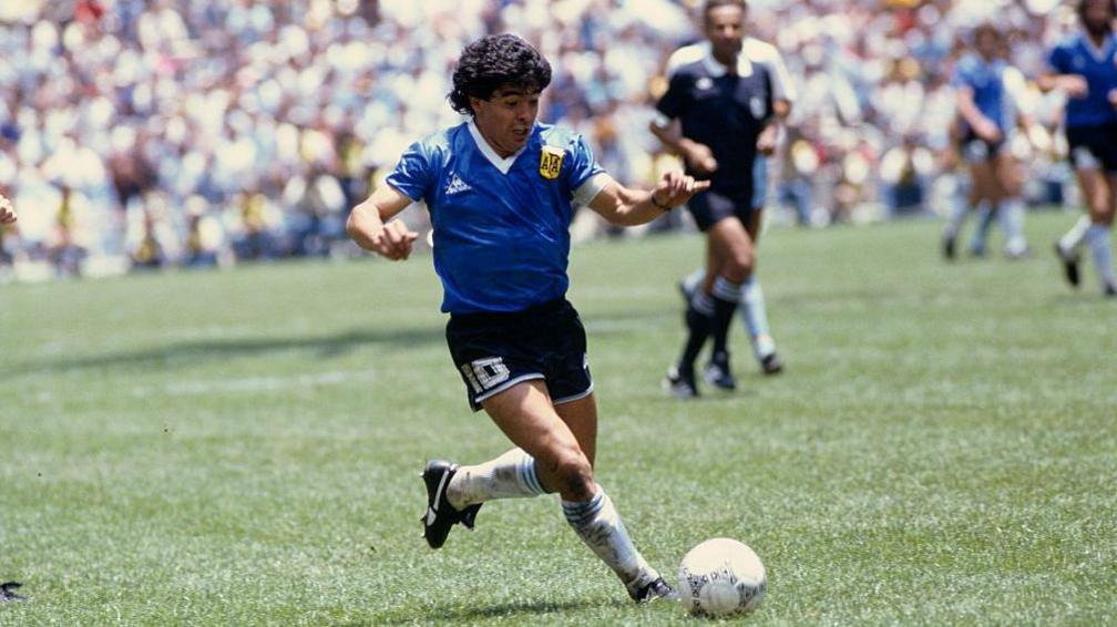 Diego Maradona playing against England in the 1986 World Cup