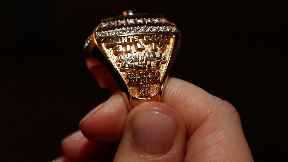New Orleans Saints Super Bowl rings displays the score: Saints 31-17 Colts, the date and Miami