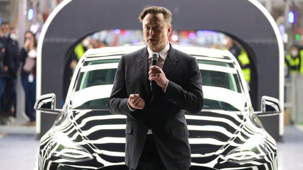 Tesla CEO Elon Musk speaks during the official opening of the new Tesla electric car manufacturing plant on March 22, 2022 near Gruenheide, Germany