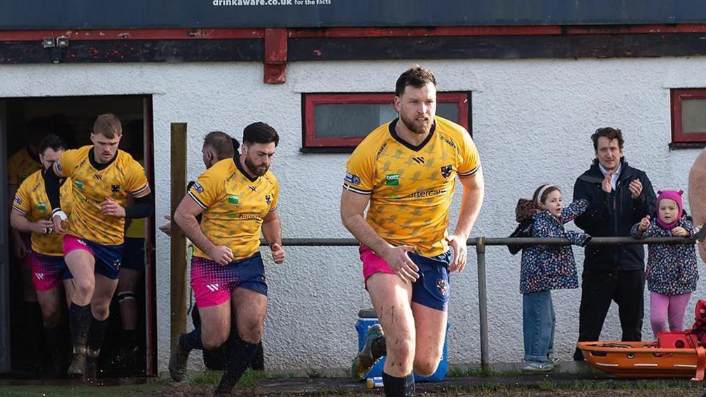 Cornwall RLFC players running out for a game