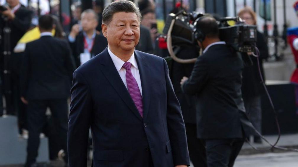 Xi Jinping, China's president, arrives for a bilateral meeting in Peru in navy blue suit.