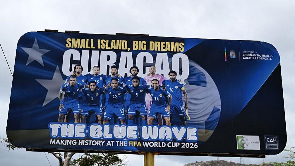 A billboard showing the Curacao team heading to the World Cup
