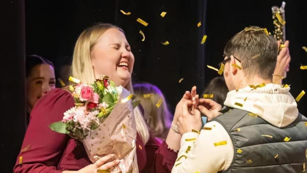 Callum proposing to Lauren at the theatre 