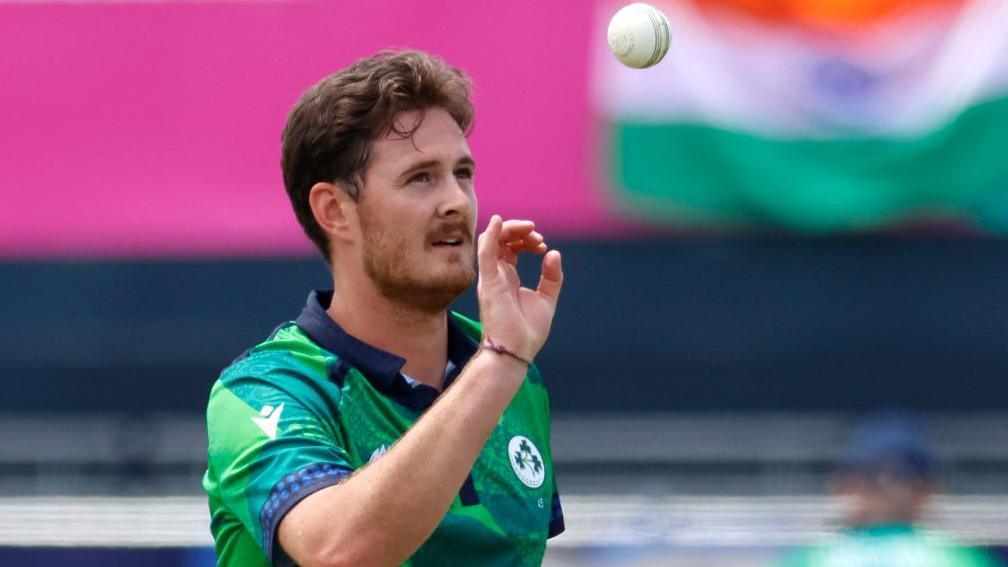 Mark Adair tossing a ball