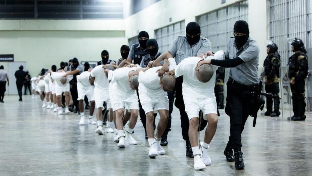 Detainees at Cecot are marched through the prison's halls